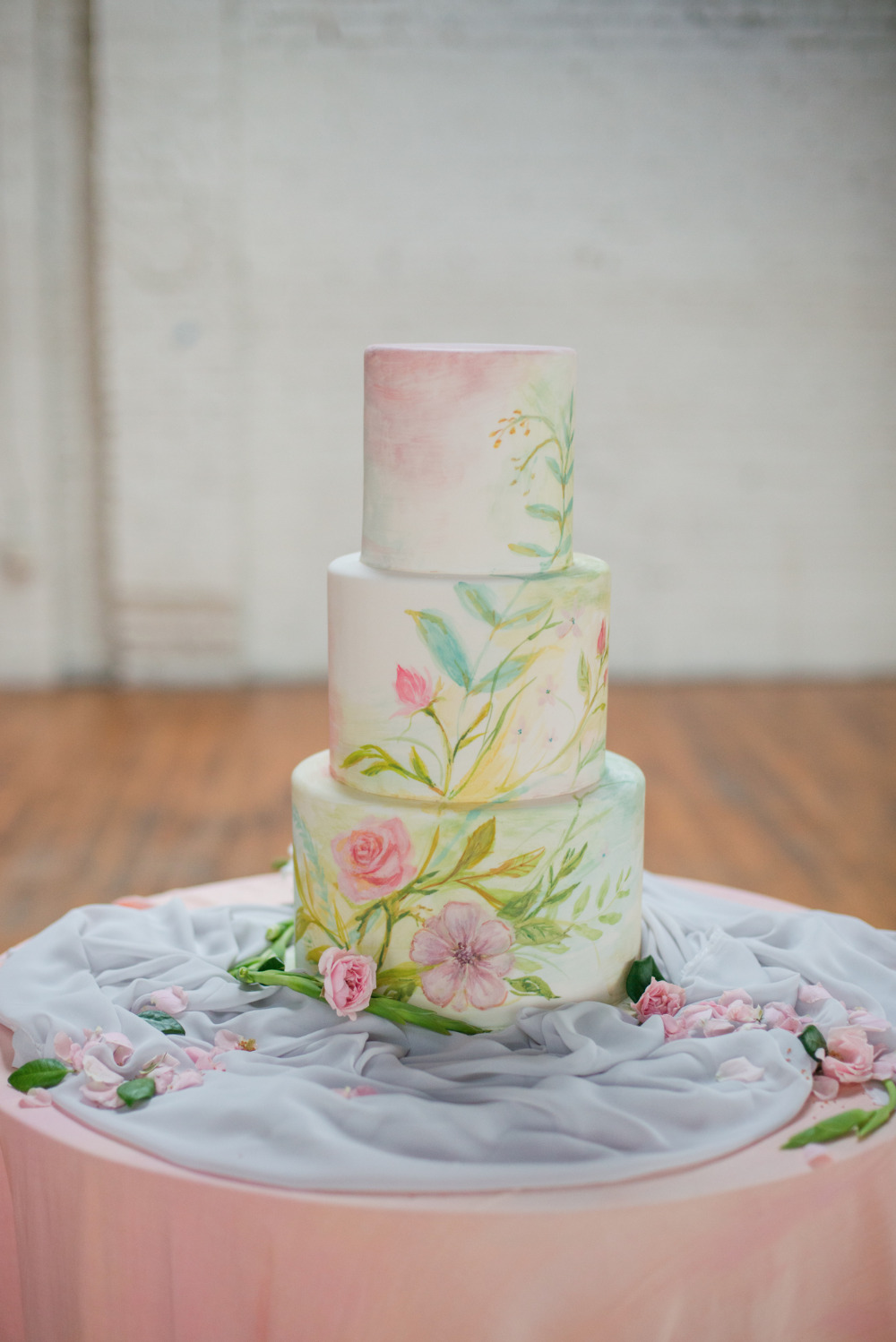 blue and pink watercolor wedding cake