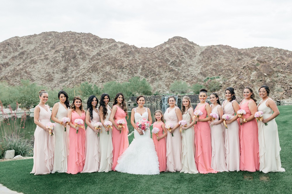 Bridesmaids in blush and coral dresses