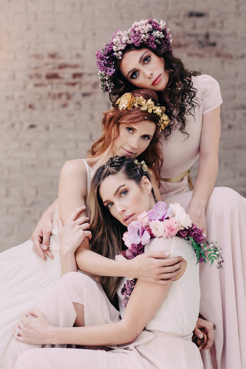 pink bridesmaid dresses with flower and gold accessories