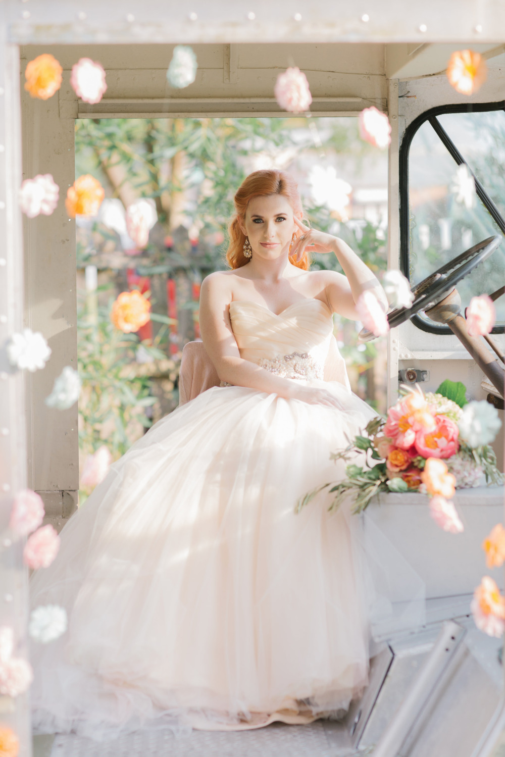 Redhead bride in a vintage dress and truck