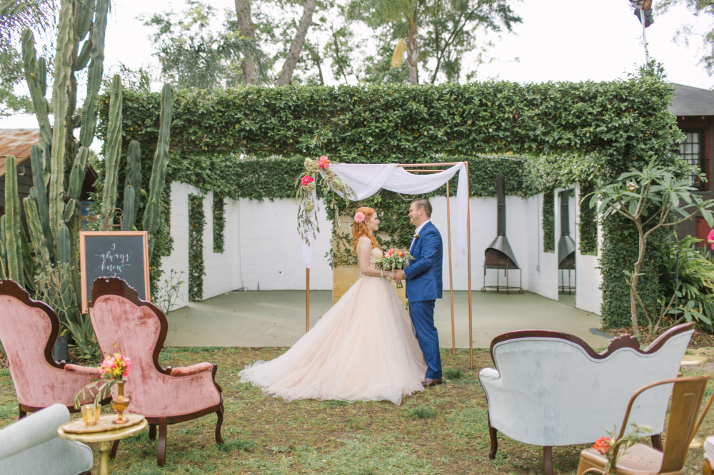 outdoor wedding ceremony with mix and match vintage seating