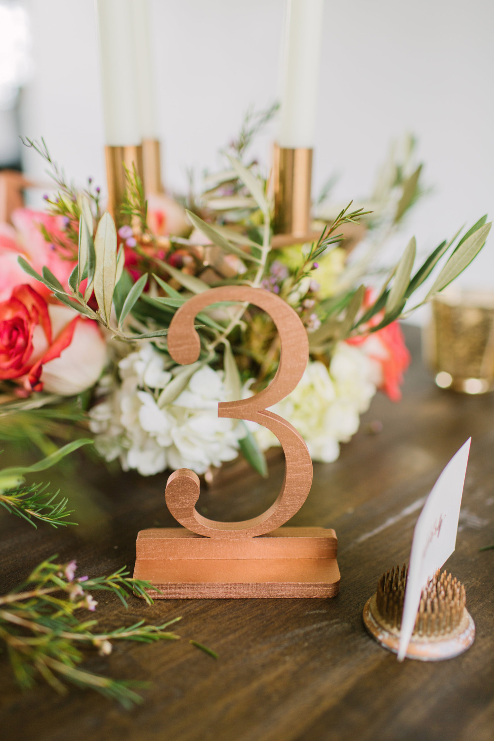 Elegant table number three with floral centerpiece decor