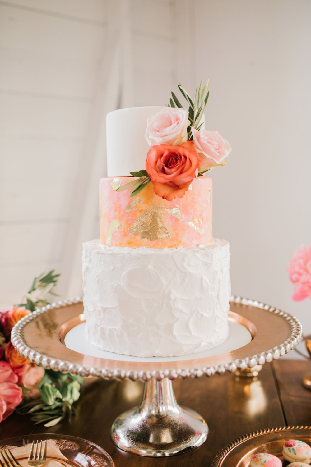 Elegant three tier wedding cake with floral accents