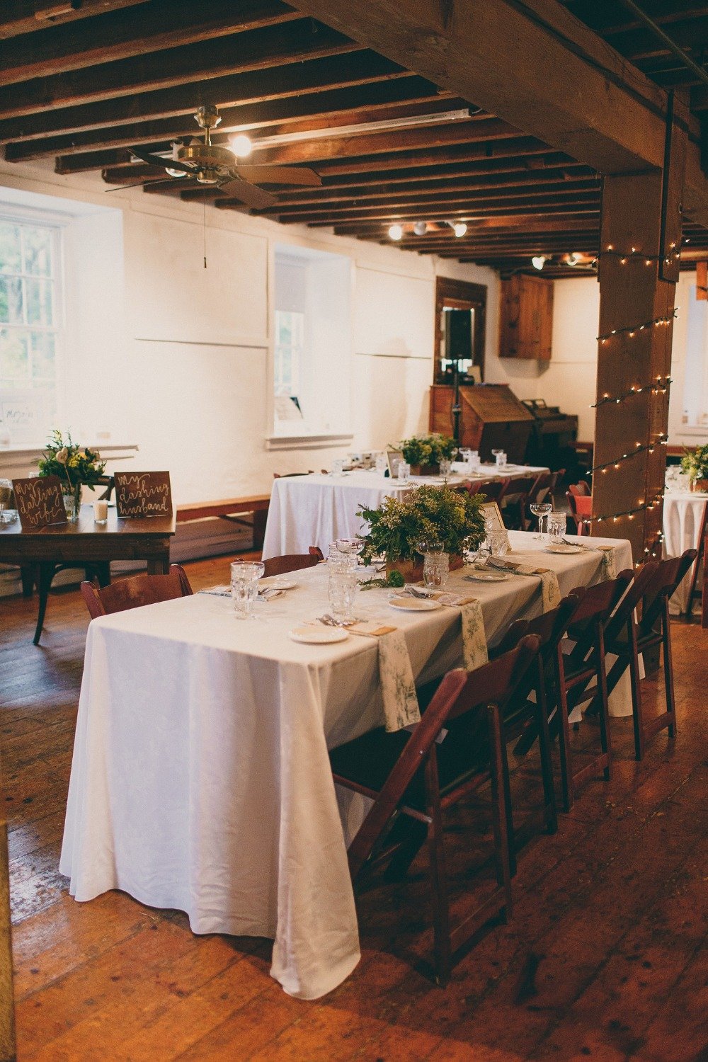 rustic indoor wedding reception in white gold and yellow