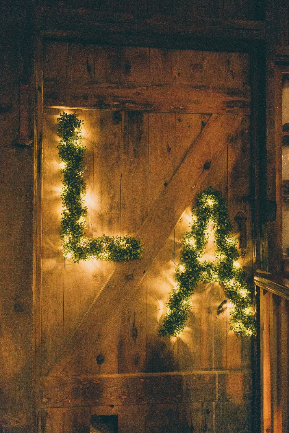 twinkle lights and greenery wedding initials