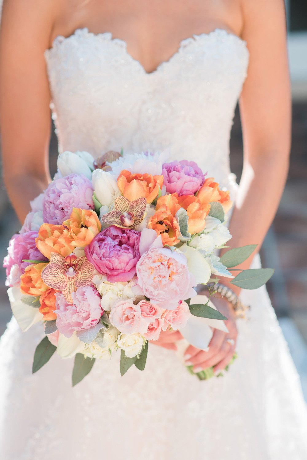 beautiful pink and orange rose and peony and orchid bouquet