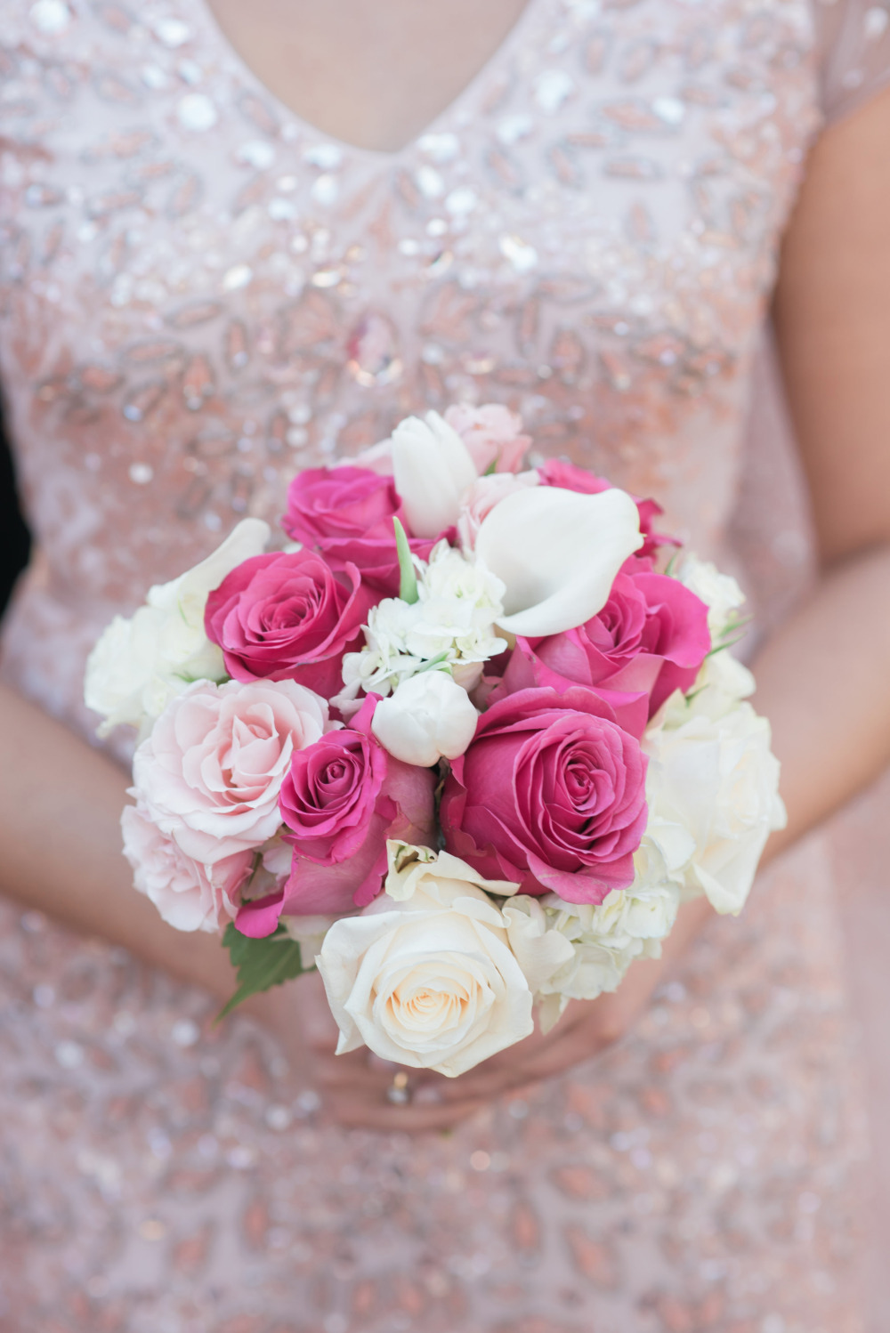 Pink roses and calla lilies bridal bouquet closeup