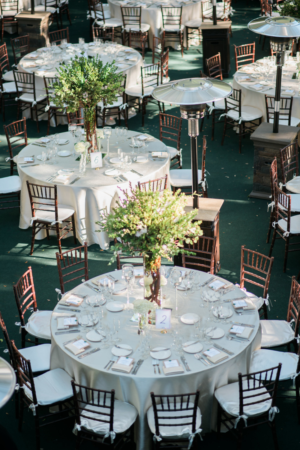 Elegant outdoor wedding reception with round tables