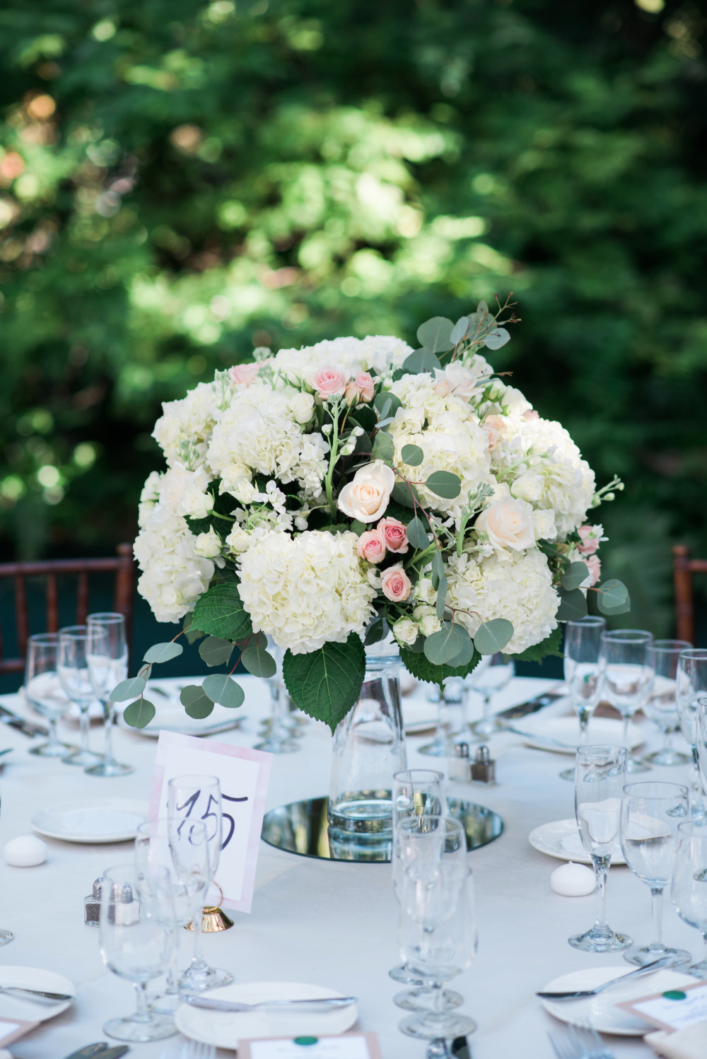 Elegant white floral centerpiece on a wedding table