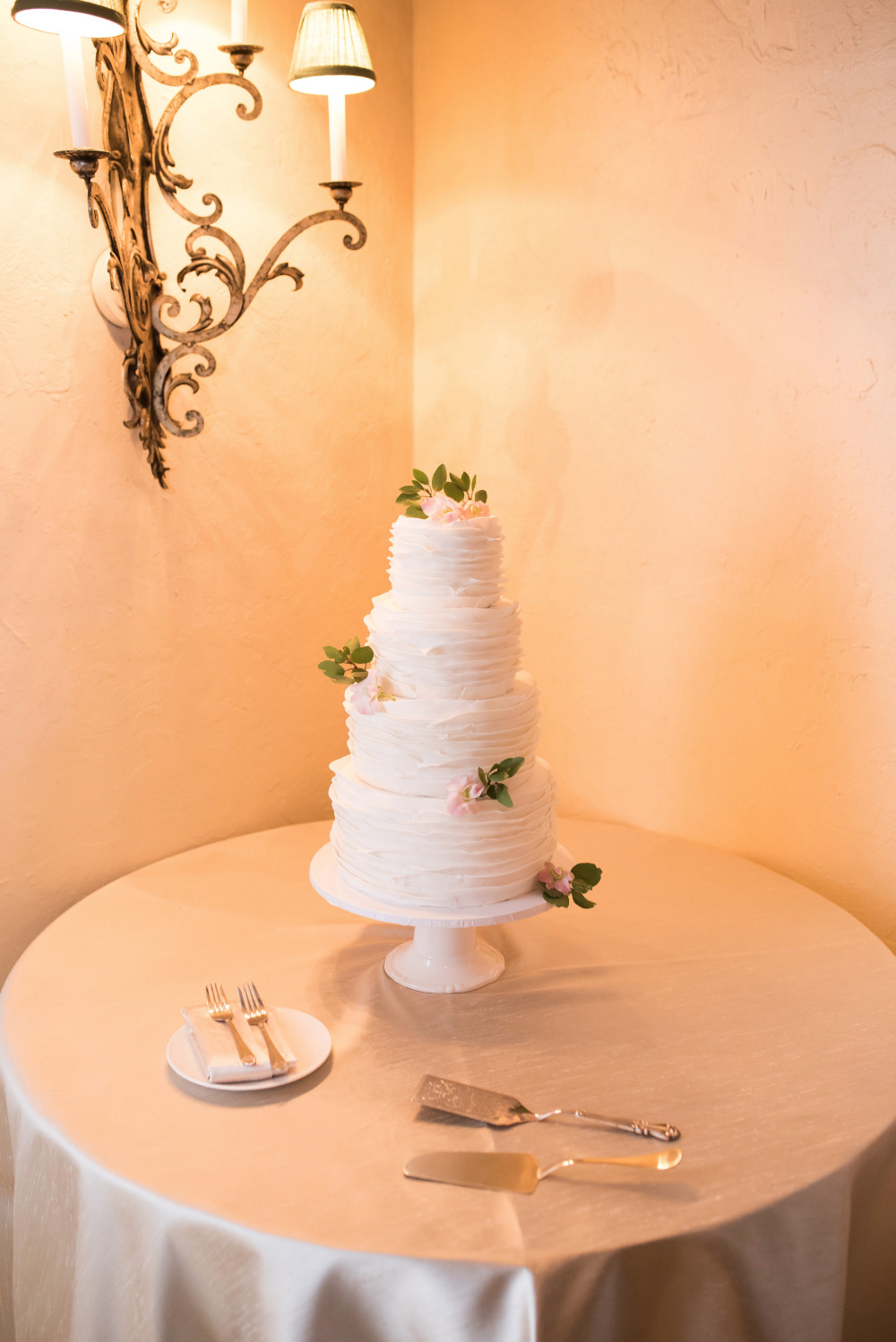 Elegant five tier wedding cake with floral accents