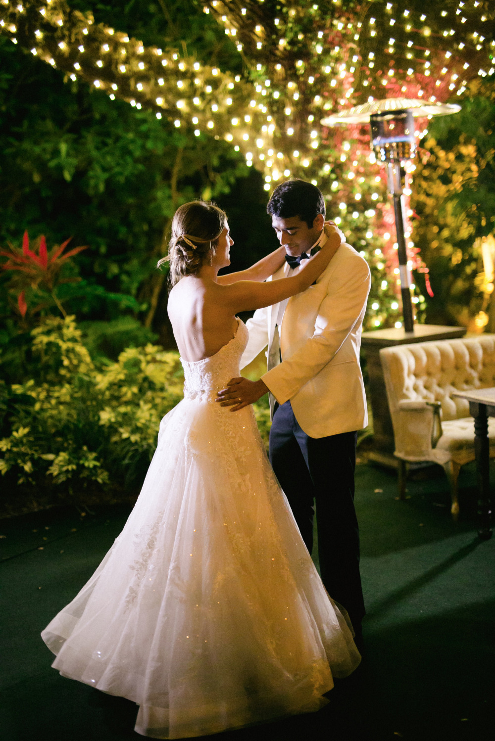 Bride and groom share first dance at outdoor wedding