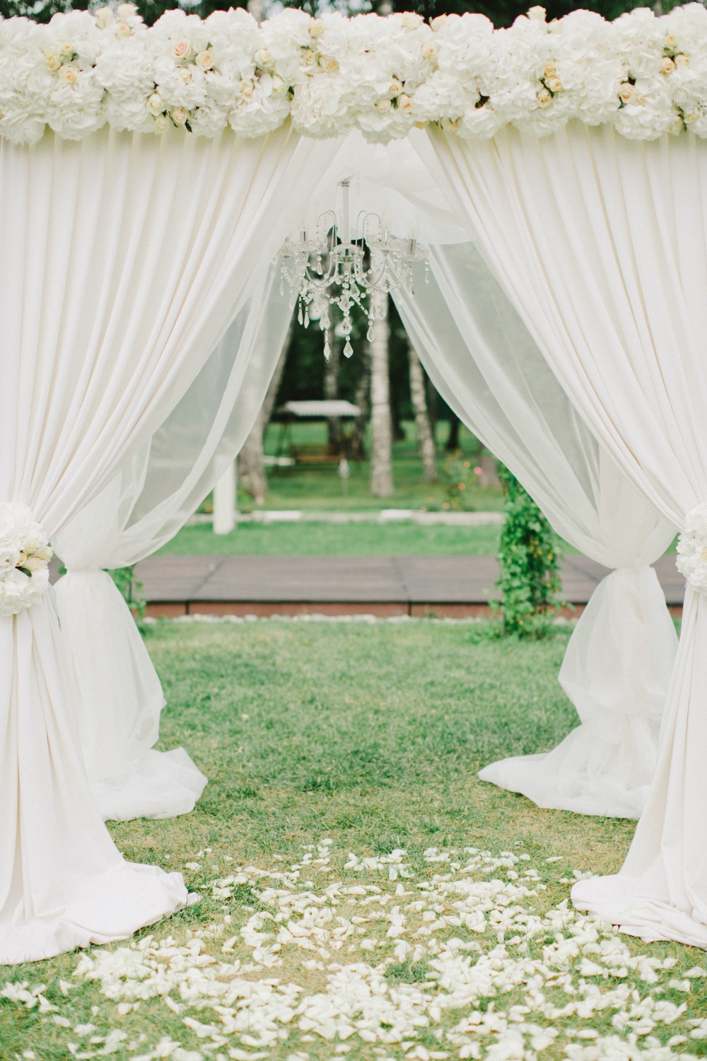 White wedding arbor with chandelier