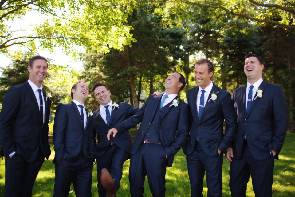 groomsmen in royal blue ties and navy suits