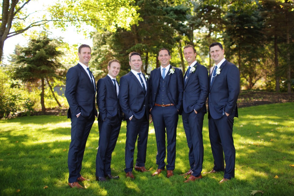 groom and his men in navy suits