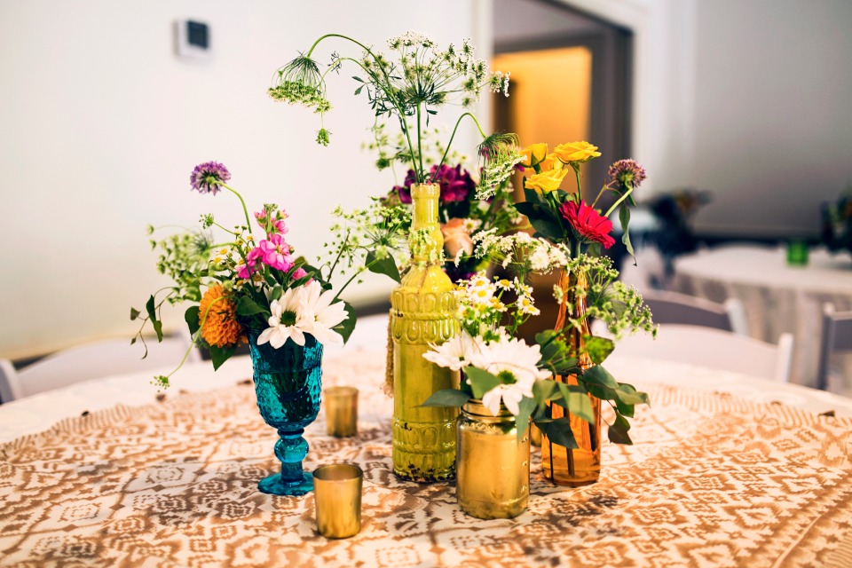 mismatched centerpieces with wildflowers