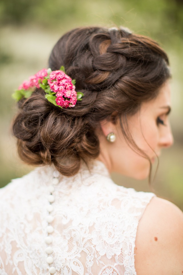 braided wedding updo with flower accents