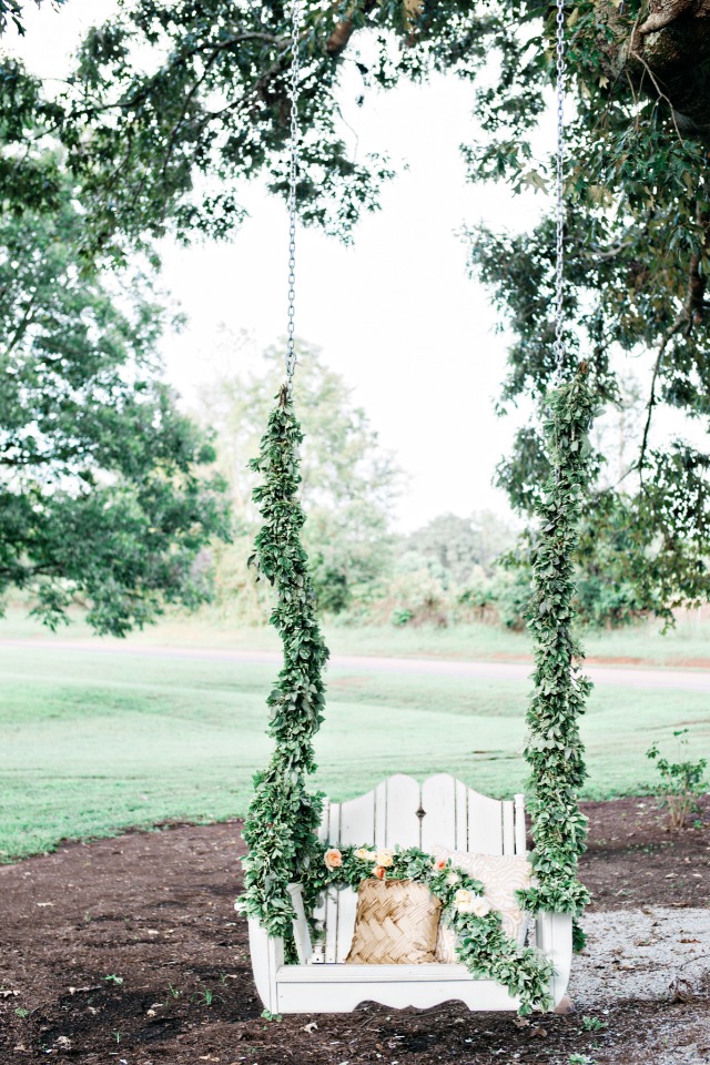 romantic greenery garland draped swing