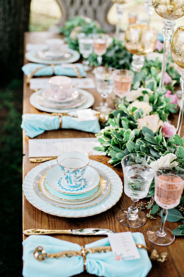 soft blue and light pink with gold accents throughout the garden table decor