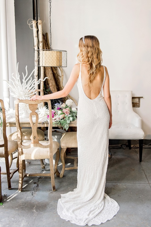 dramatic back showcasing sheath wedding gown