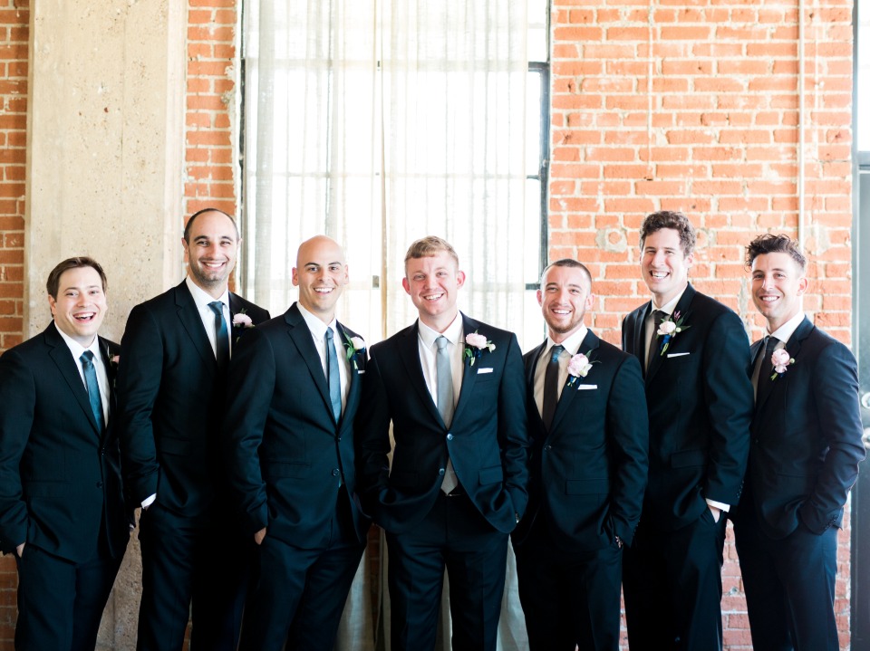 groom and his men in classic black suits and blue ties