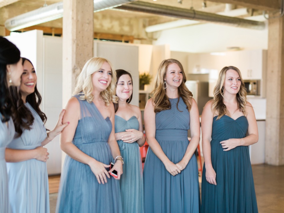 bridesmaids get a first look of the bride