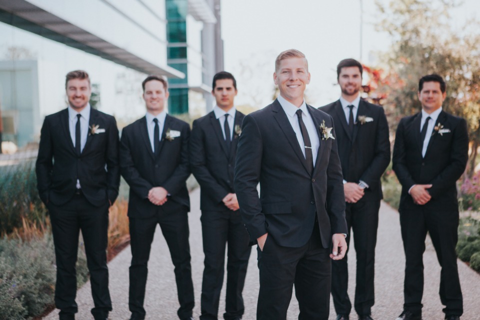 classic groom and groomsmen in black suits