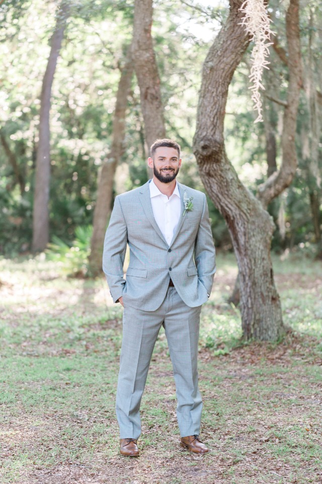 groom in light gray suit from Men's Wearhouse