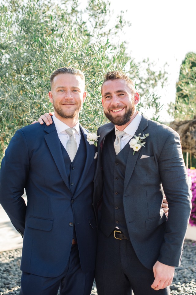 groom and groomsmen in three piece suits