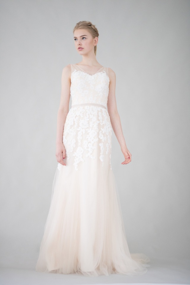 Elegant lace wedding gown with tulle skirt