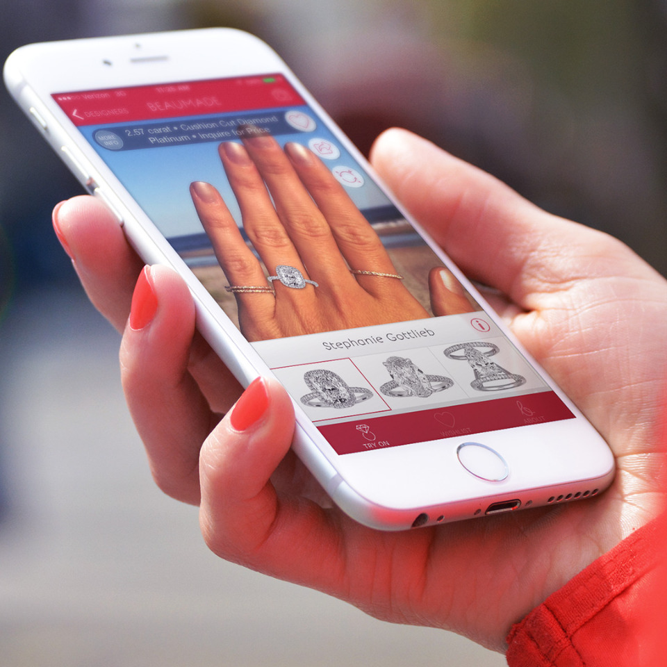 Woman trying on engagement ring using app