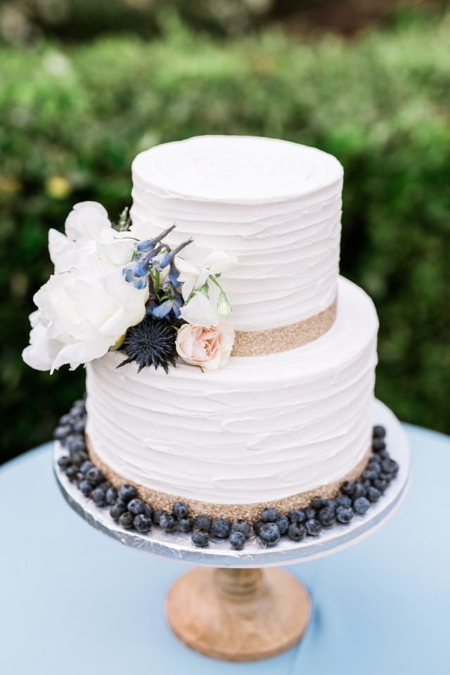 gold and blueberry wedding cake