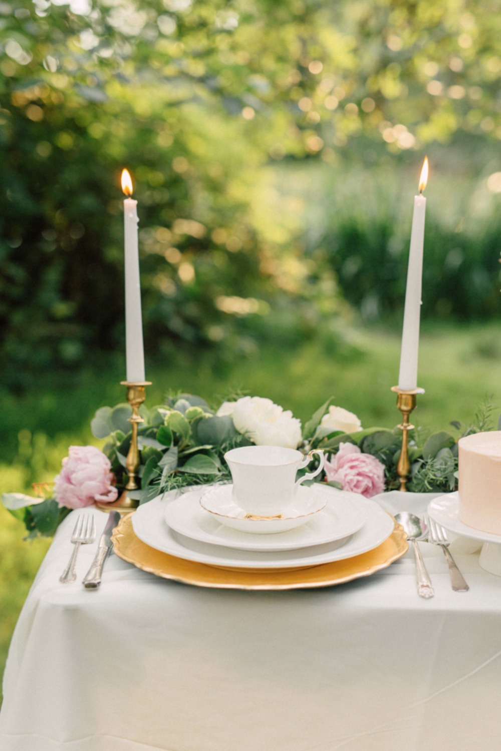 Garden table setting with candle sticks