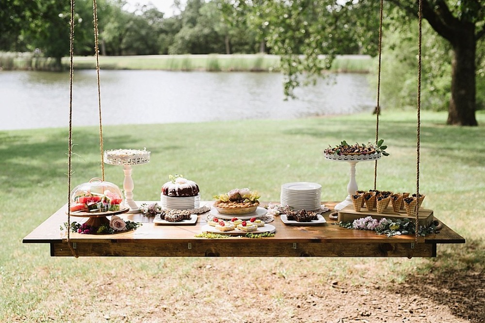 Hanging dessert table idea for an outdoor wedding