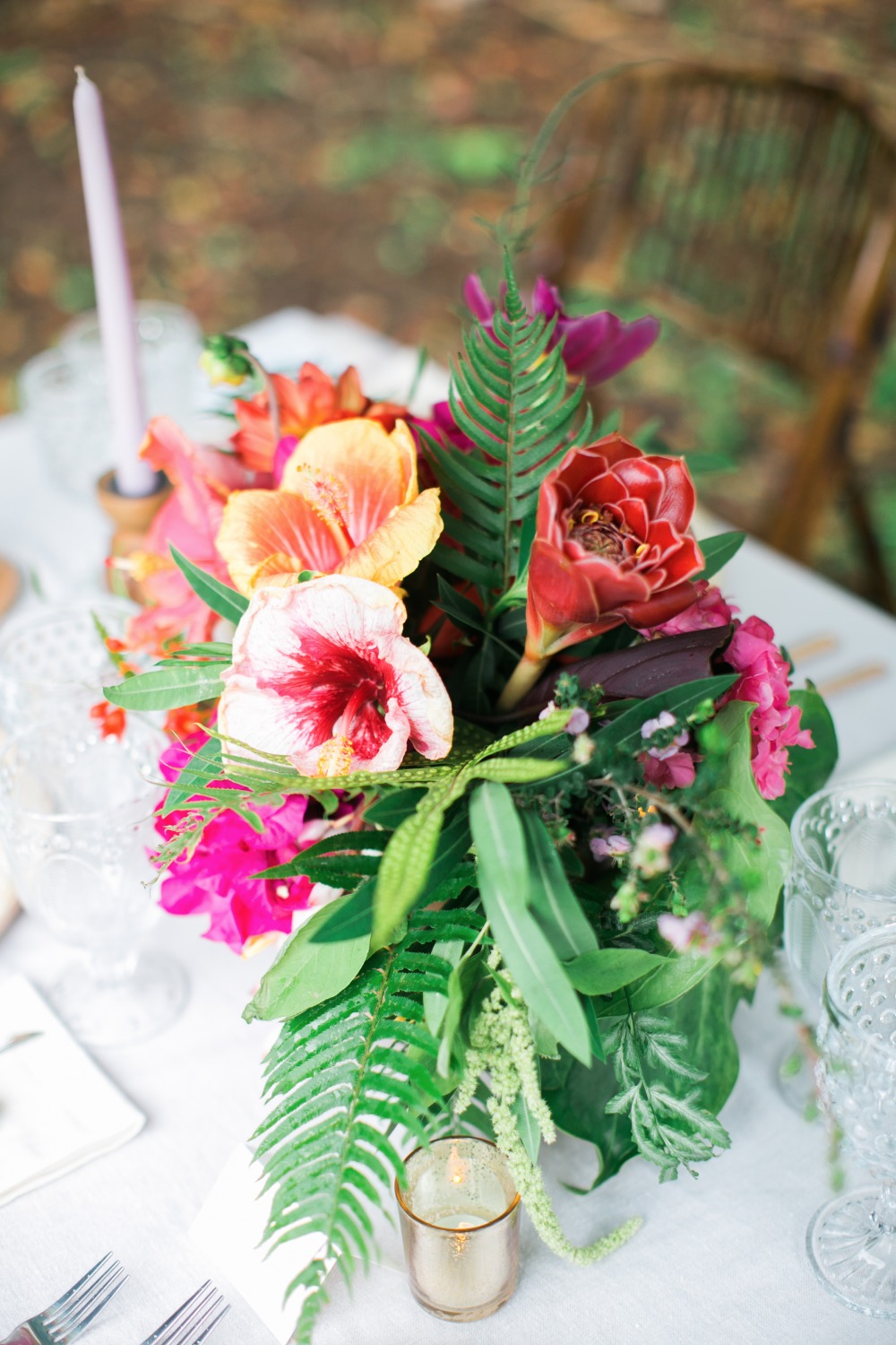 Vibrant tropical flower centerpiece with hibiscus blooms
