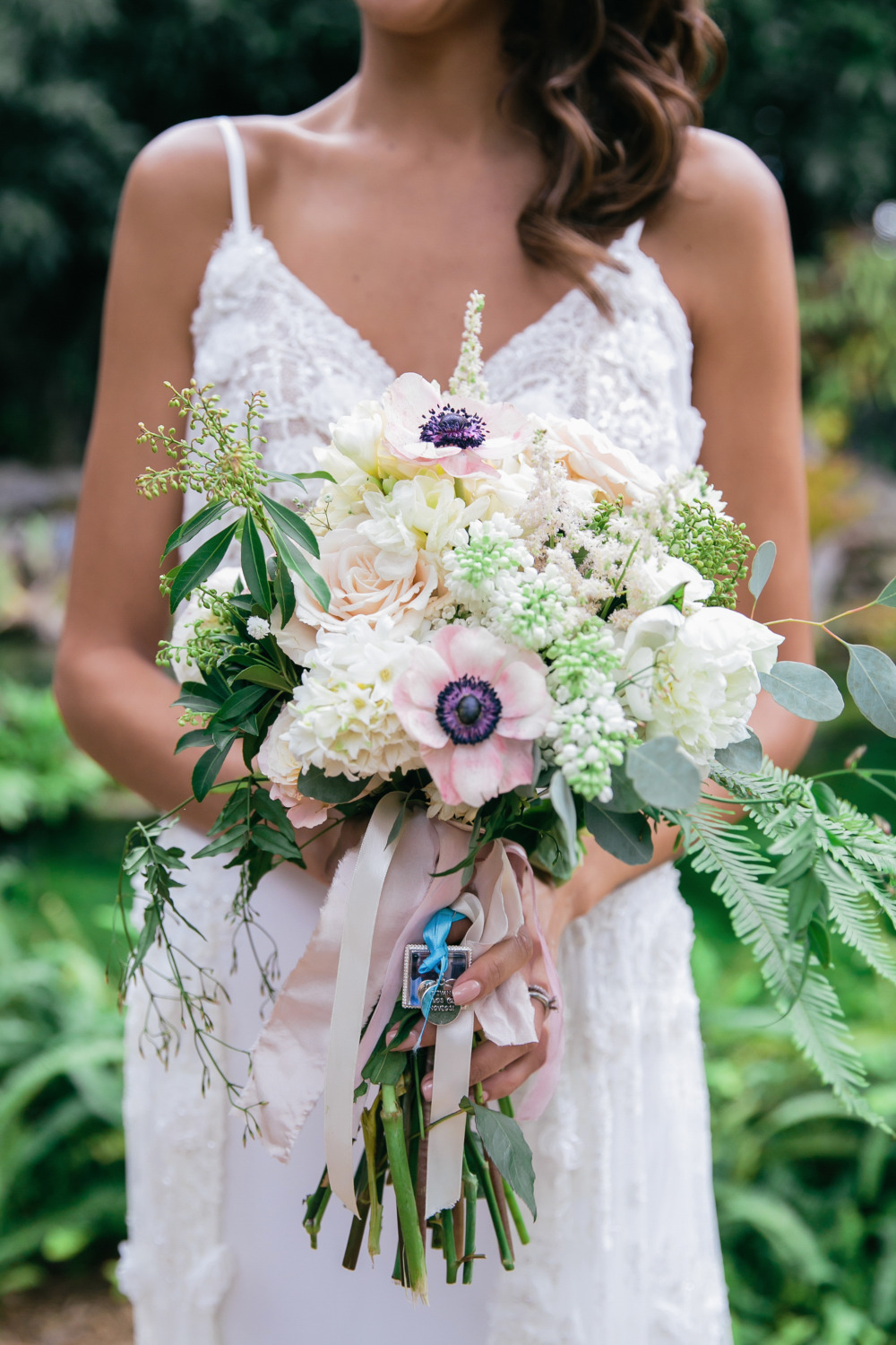 pretty anemone and rose wedding bouquet