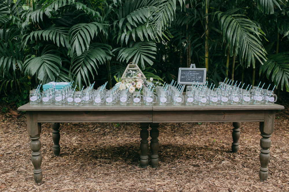 mason jar glasses as wedding favors and table numbers