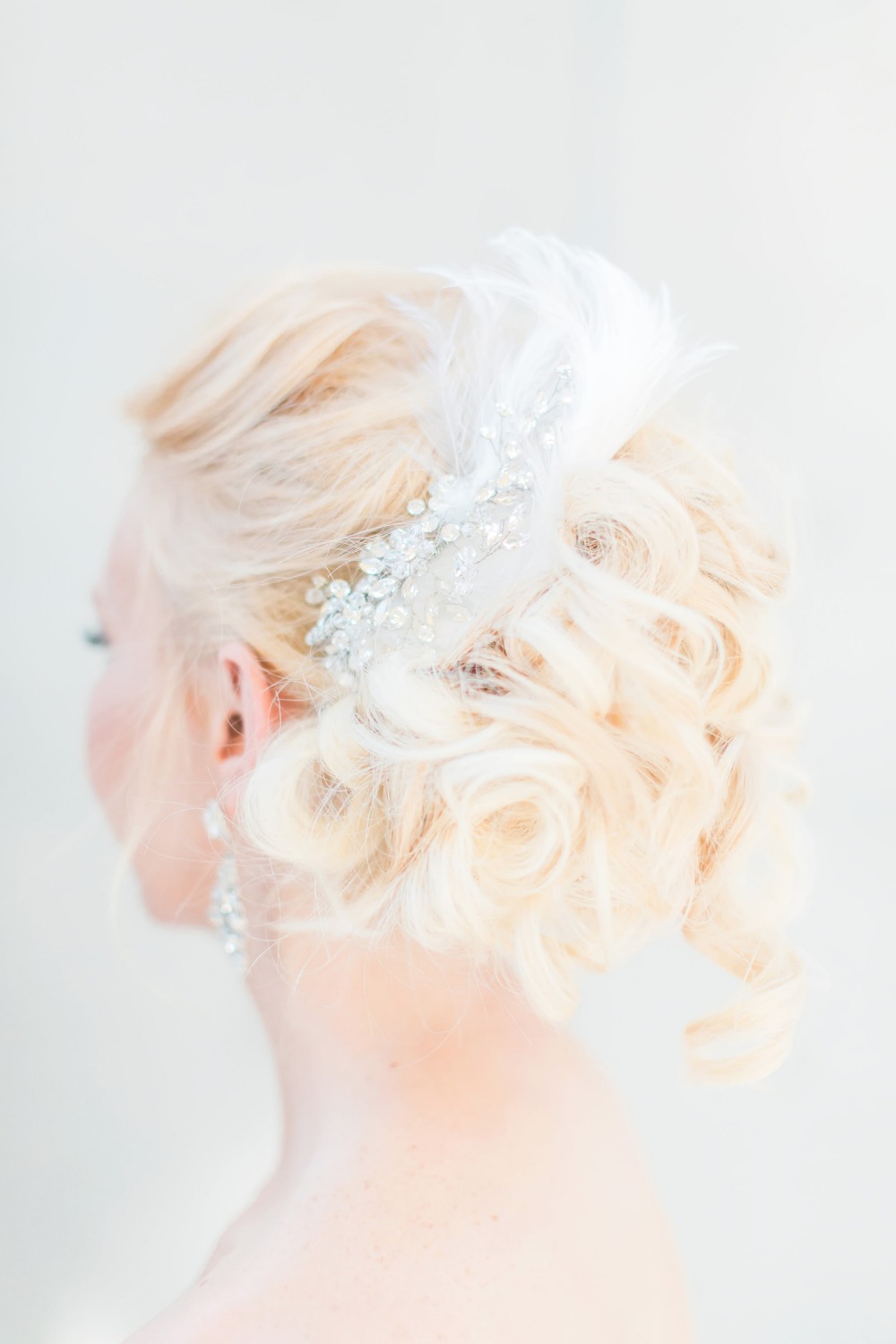 Feather and crystal hair accessory