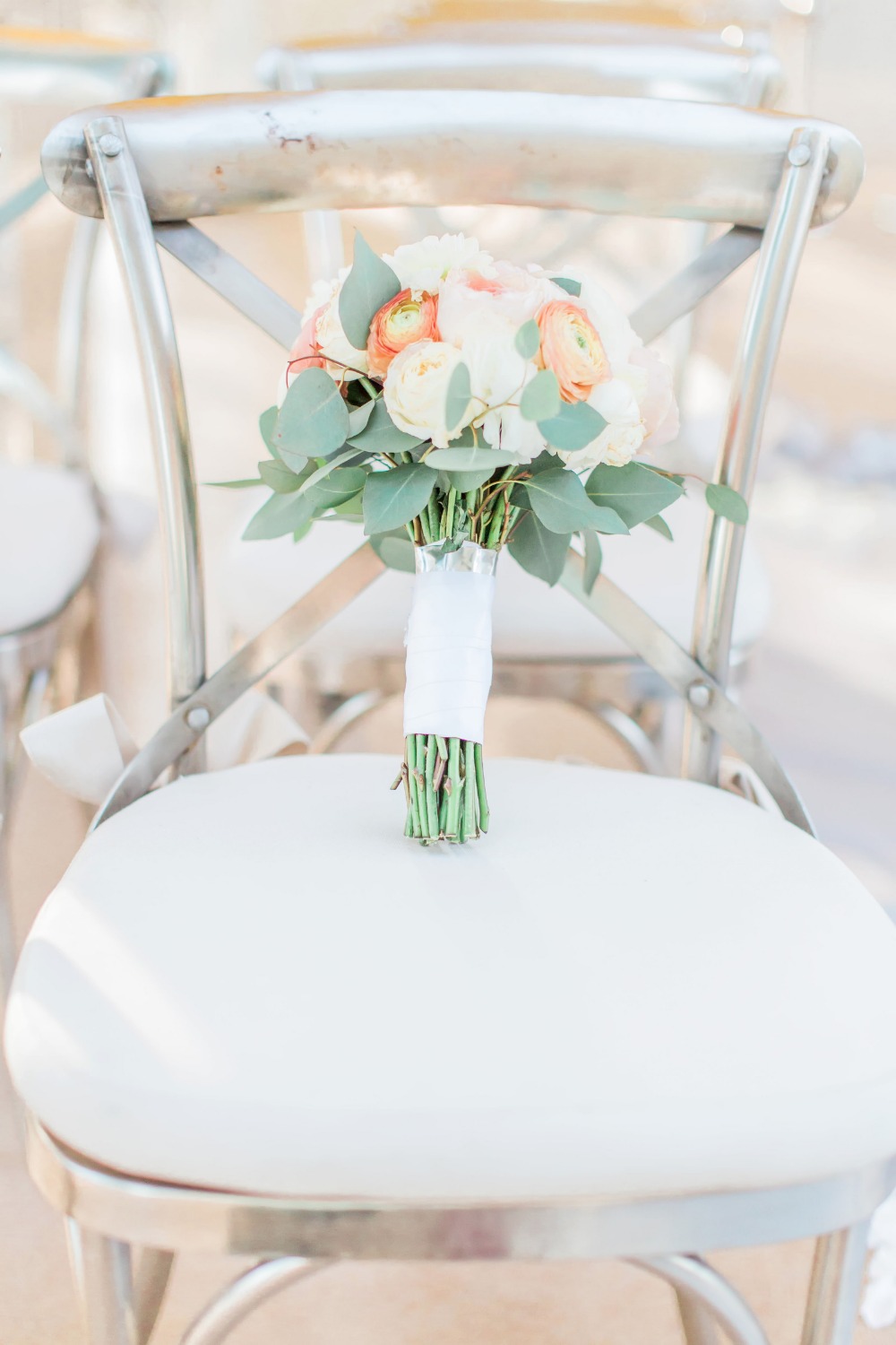 Silver chairs and bouquet