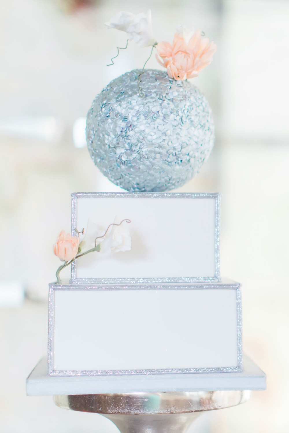 Silver cake with blush floral accents