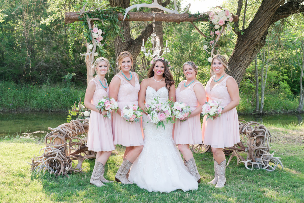 pink bridesmaids with cowgirl boots