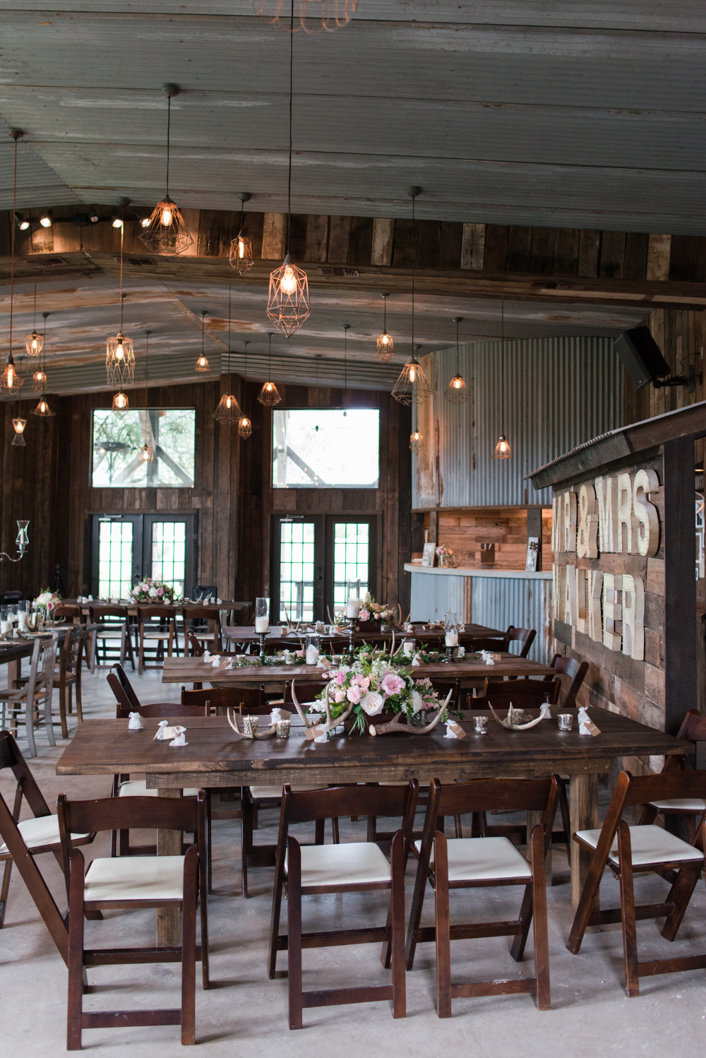 rustic barn wedding reception with antler decor