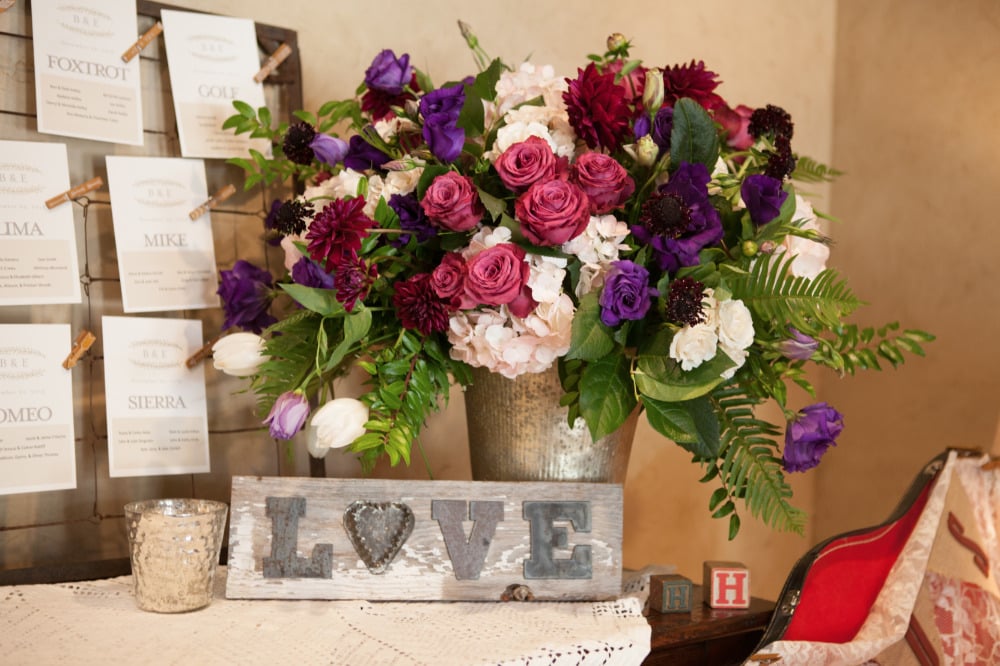 love wedding sign with wedding flowers decor