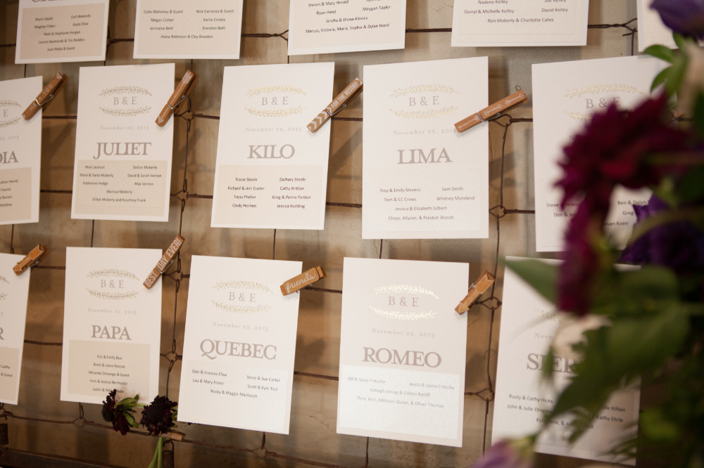 gold escort cards with clothespins