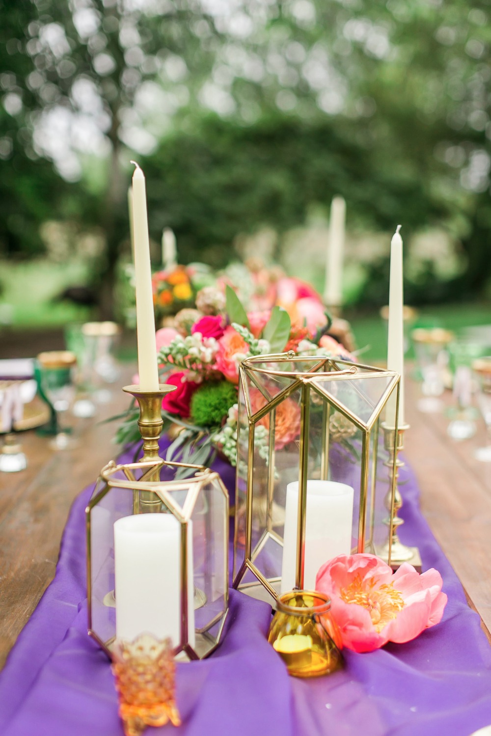 Candle centerpiece and purple table runner