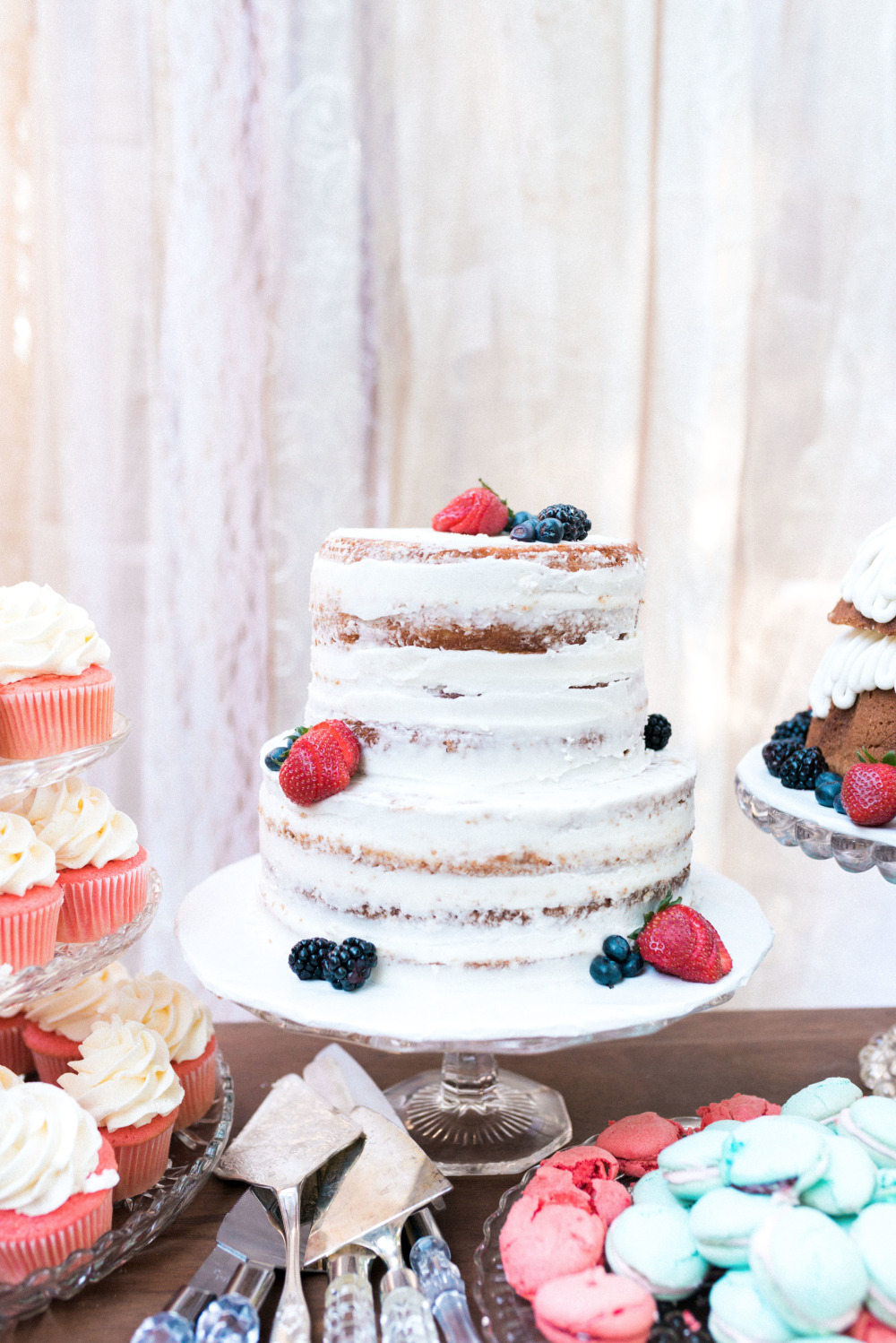 half naked wedding cake with berries