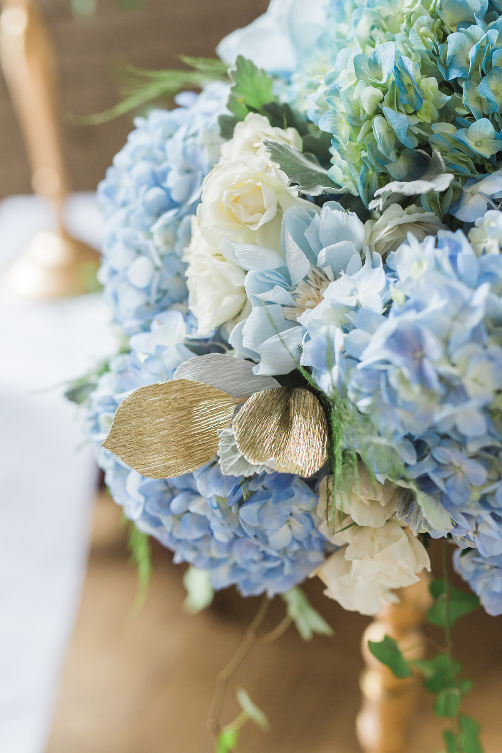 blue crepe paper and real flowers decor