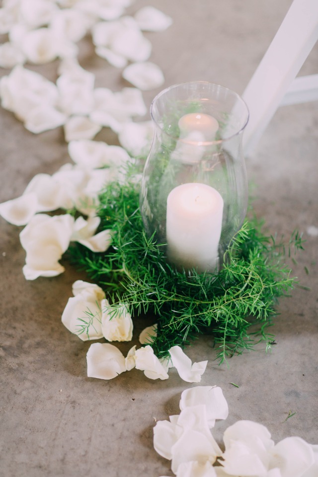 flower petals and candles lined the aisle