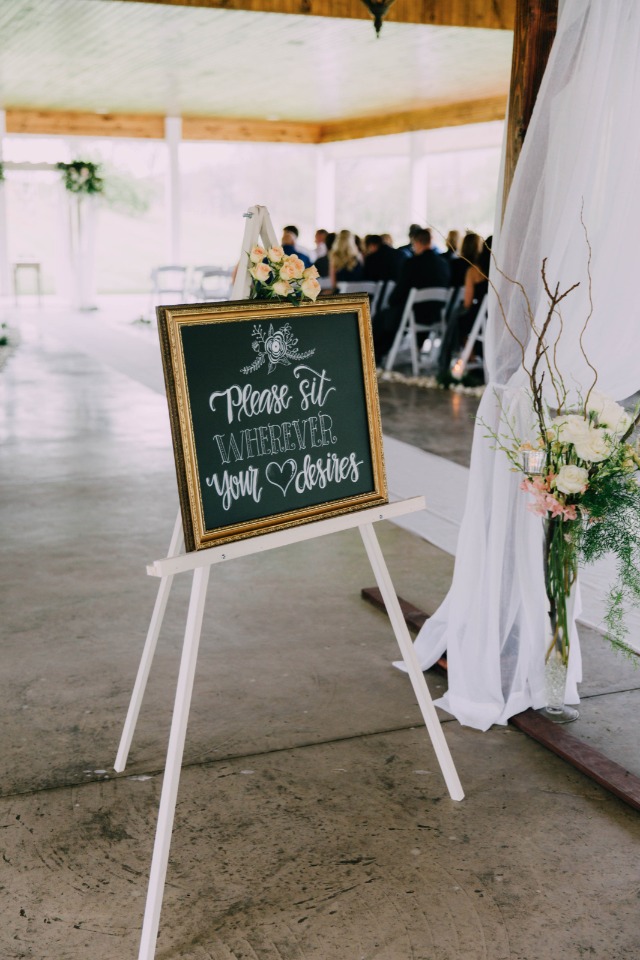please sit where your heart desires wedding sign