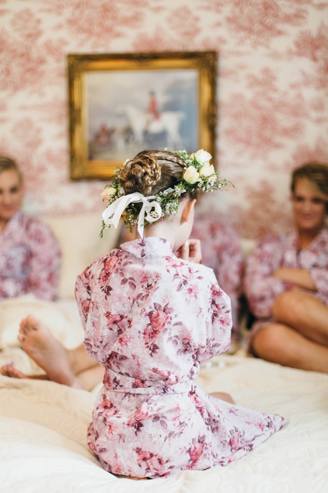 cute little flower girl in her getting ready robe