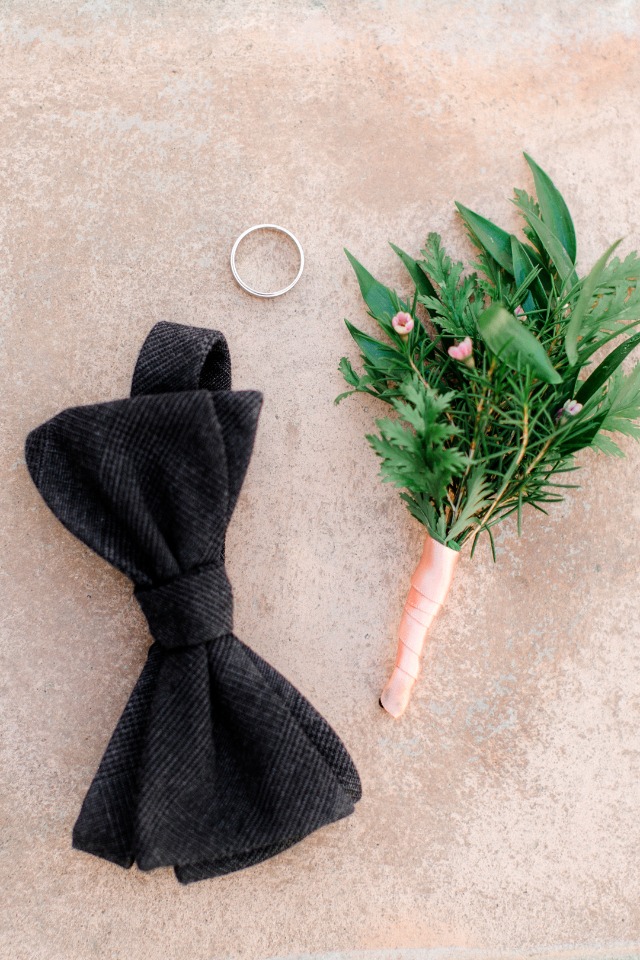 Wedding details bow tie ring and boutonniere groom prep